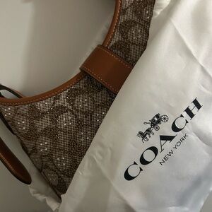 Hamptons Hobo Bag
In Crystal Signature Jacquard